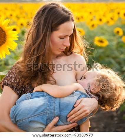 African Women Breastfeeding Animals