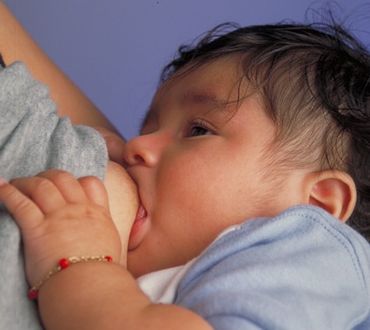 African Women Breastfeeding Animals