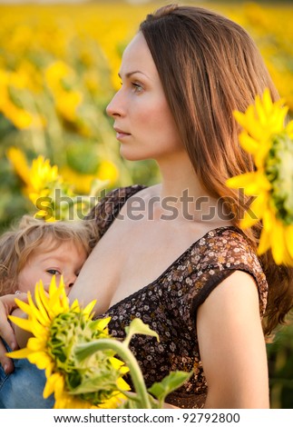 African Women Breastfeeding Animals