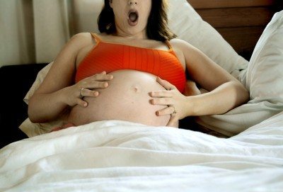 Pregnant Women Giving Birth To A Baby