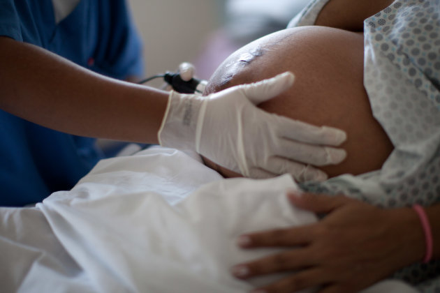 Pregnant Women Giving Birth To A Baby At School